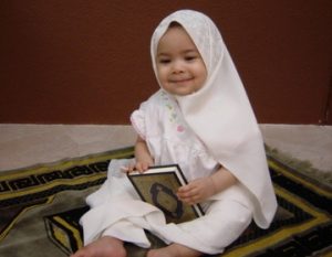 Baby Holding the Quran